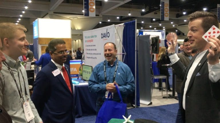 Tradeshow presenter Jonathan Pritchard in front of a busy booth